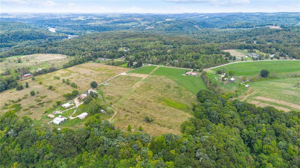 1663 Banning Road Dawson, PA 15428 - Photo 11 of 15 a view of a lush green hillside and a houses
