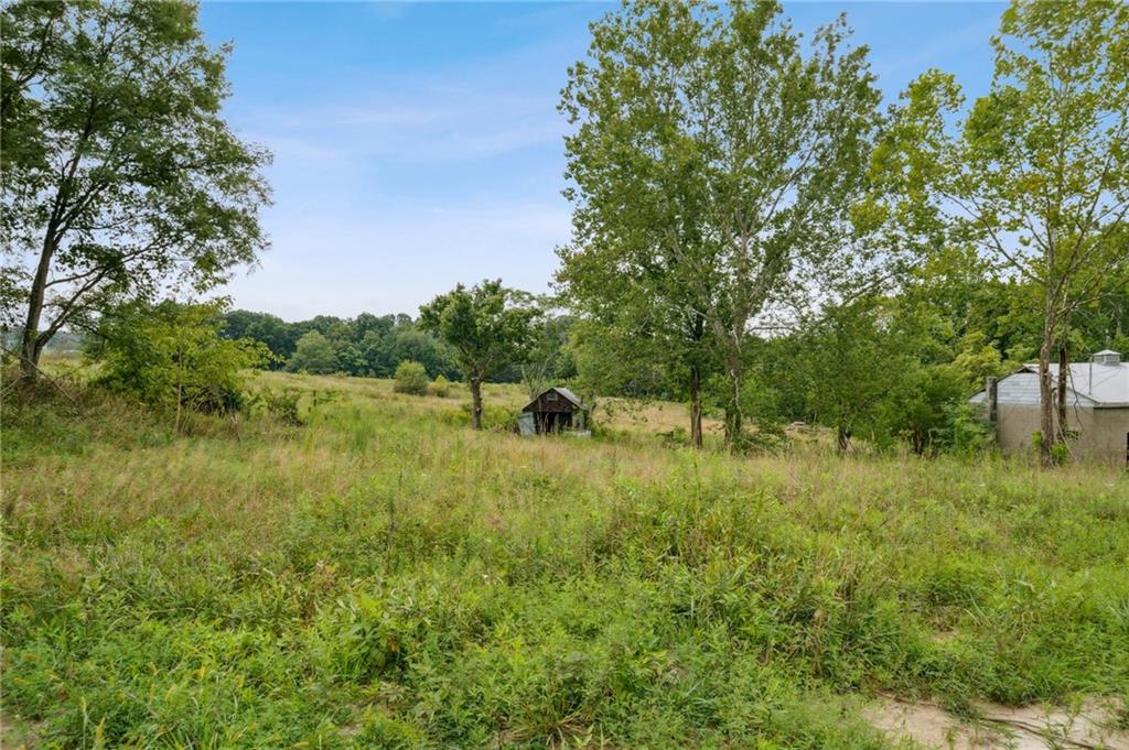 1663 Banning Road Dawson, PA 15428 - Photo 7 of 15 a view of a lake view with a garden