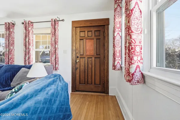 a bedroom with a bed and dresser