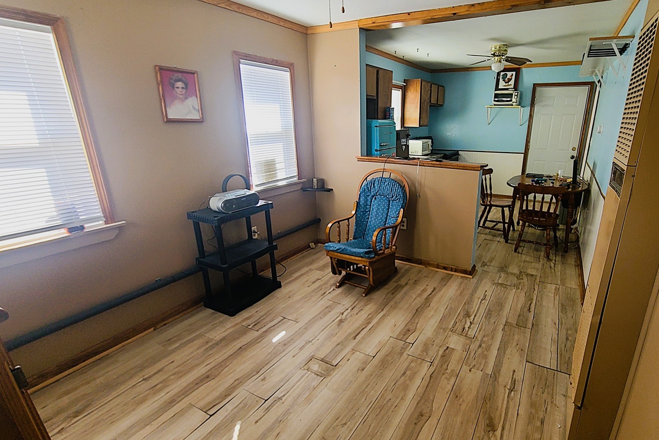 1106 Steinman Street Dixon, IL 61021 - Photo 4 of 14 a view of a workspace with furniture and a window