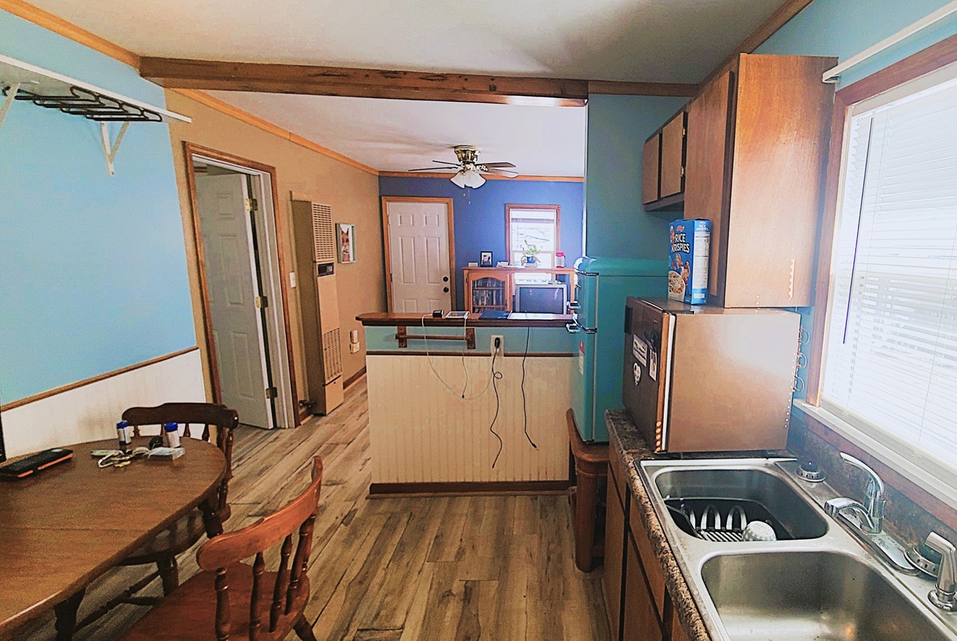 1106 Steinman Street Dixon, IL 61021 - Photo 6 of 14 a kitchen with sink refrigerator and stove