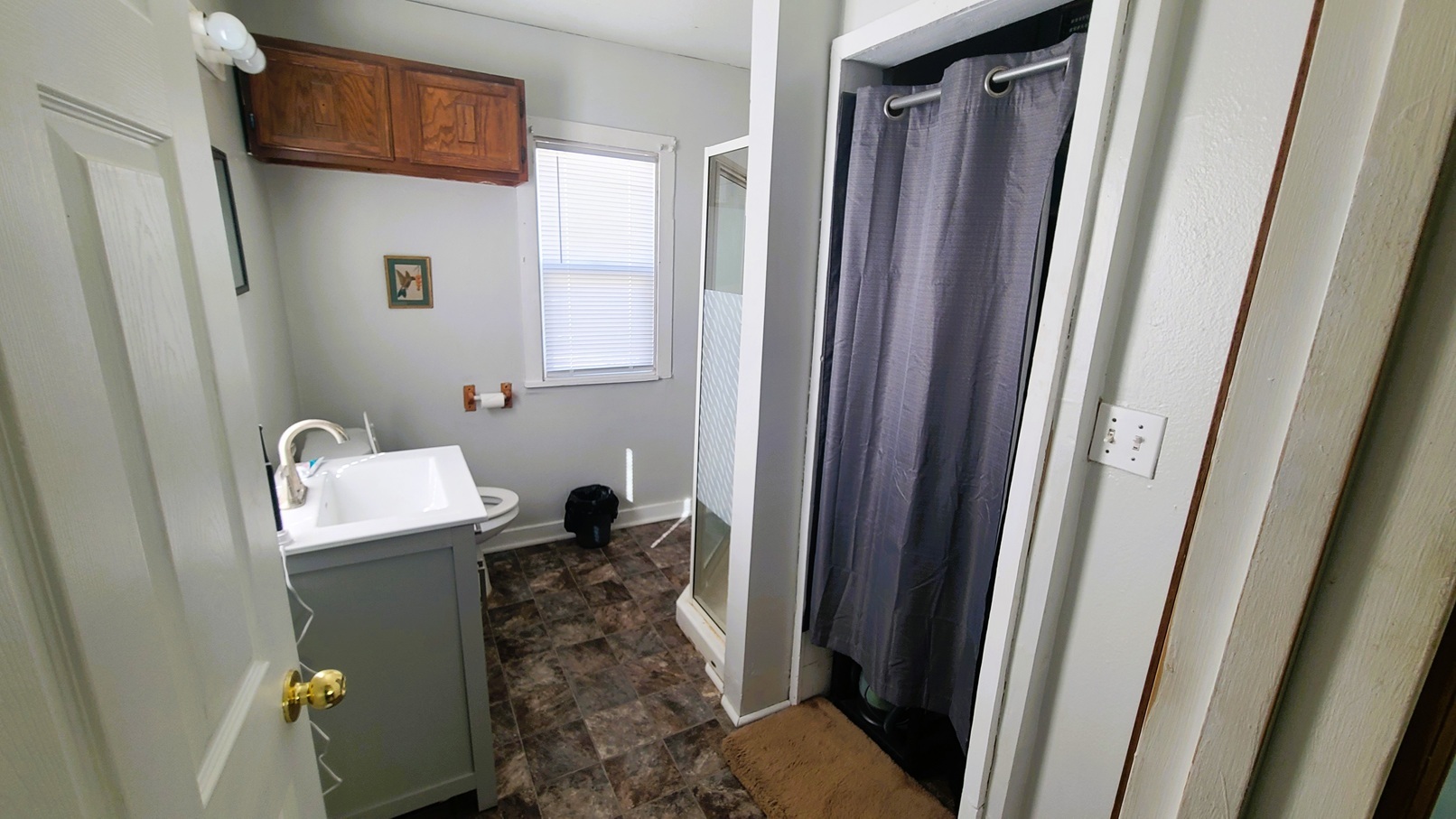 1106 Steinman Street Dixon, IL 61021 - Photo 8 of 14 a bathroom with a granite countertop sink and a mirror