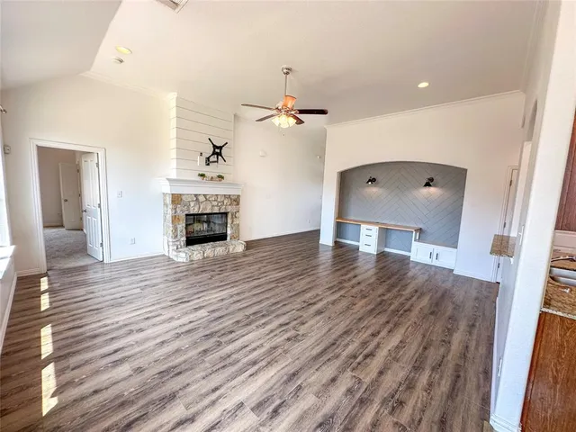 wooden floor fireplace and natural light