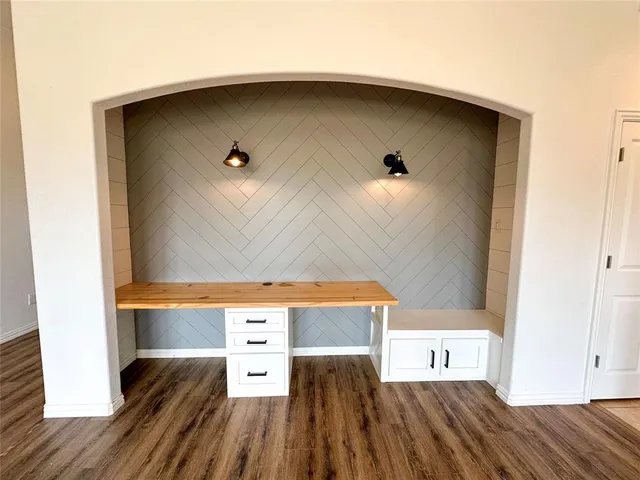 a view of kitchen and wooden floor