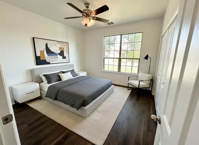 a bedroom with a bed and a window