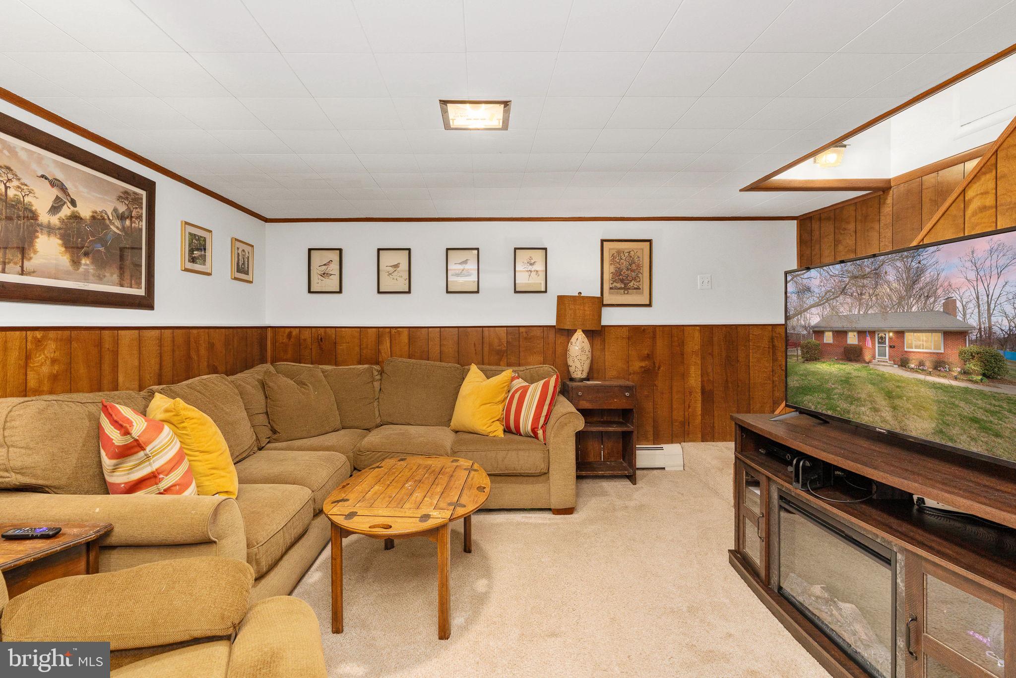6714 Ruskin Street Springfield, VA 22150 - Photo 36 of 63 a living room with furniture and a kitchen view