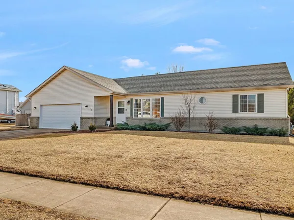 a front view of a house with yard