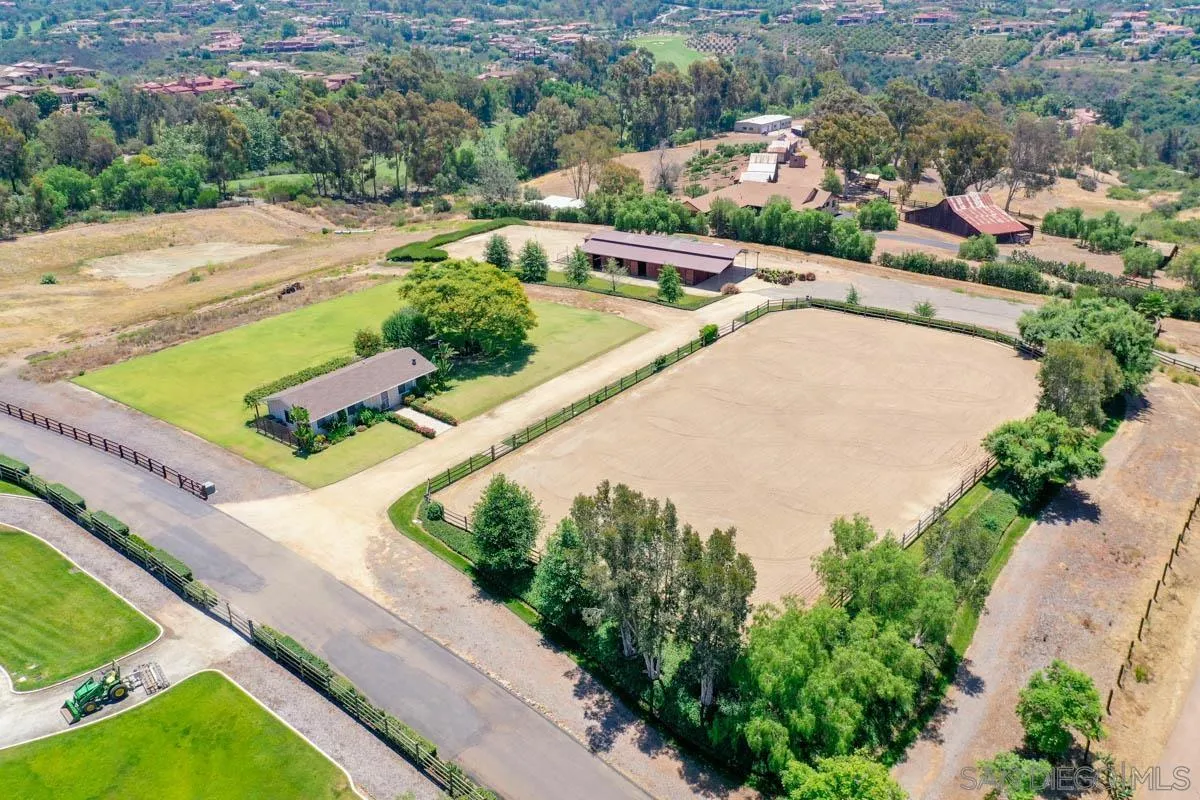 a view of a lake with a couple of cars parked on the road