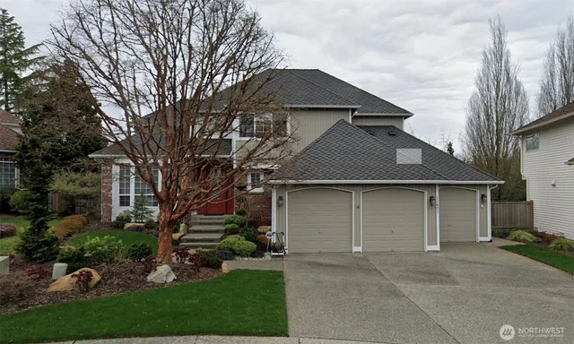 front view of a house with a garden
