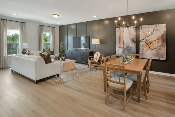 a kitchen with kitchen island a refrigerator stove and sink