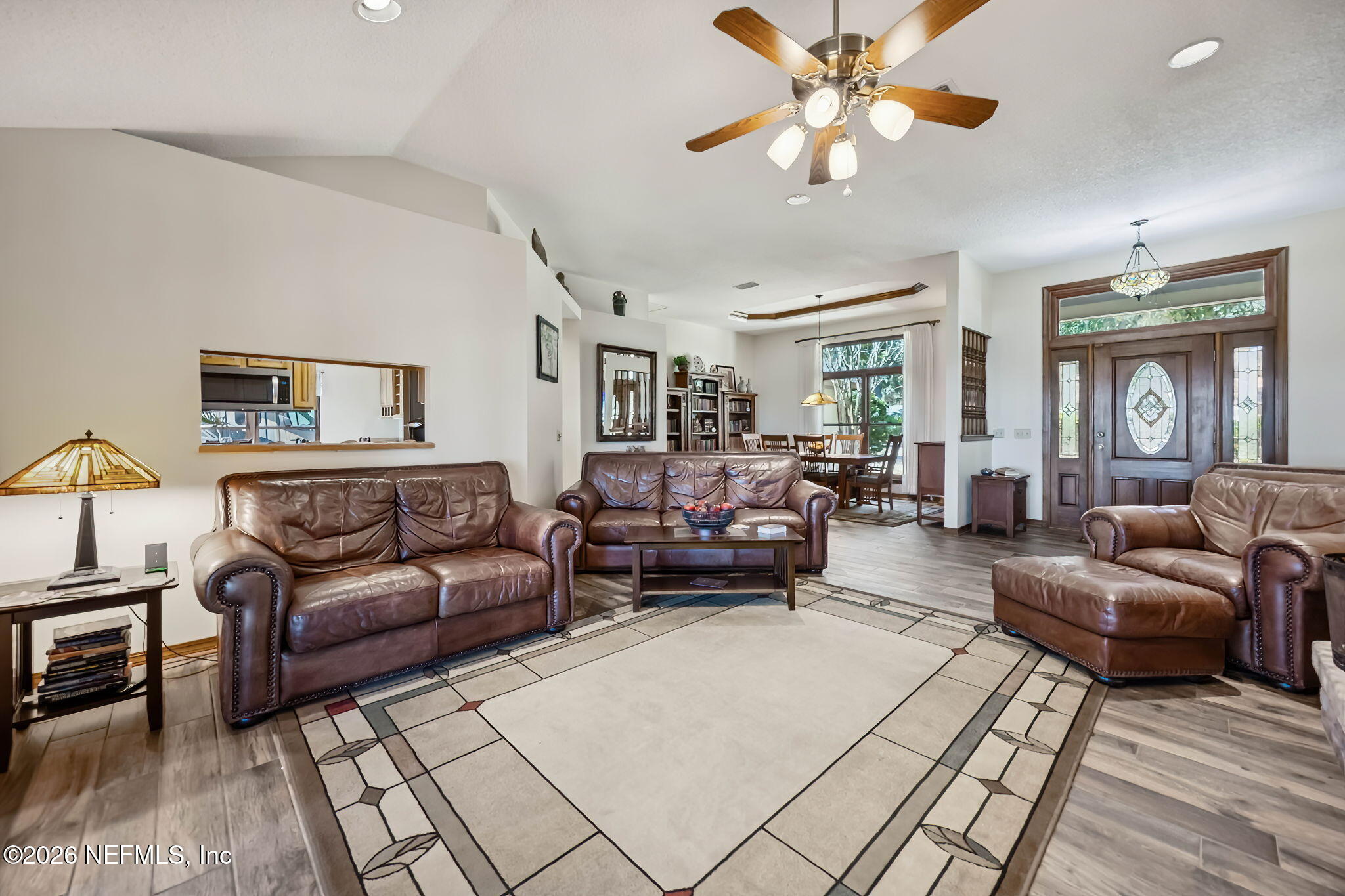 97146 Pirates Point Road Yulee, FL 32097 - Photo 11 of 74 a living room with furniture and a large window