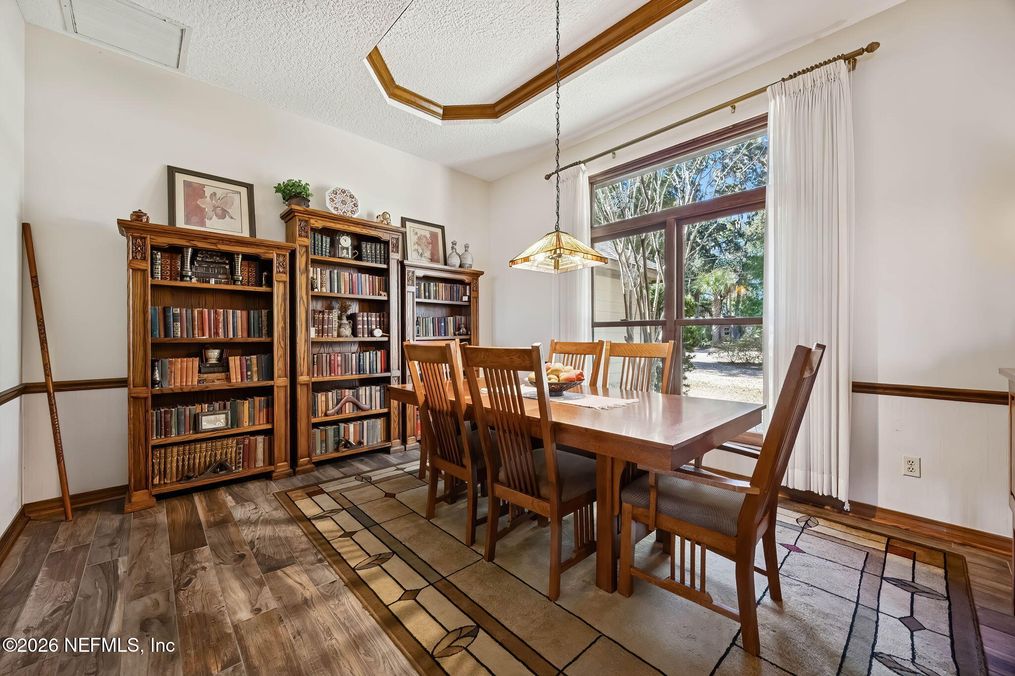 97146 Pirates Point Road Yulee, FL 32097 - Photo 14 of 74 a dining room with furniture and wooden floor