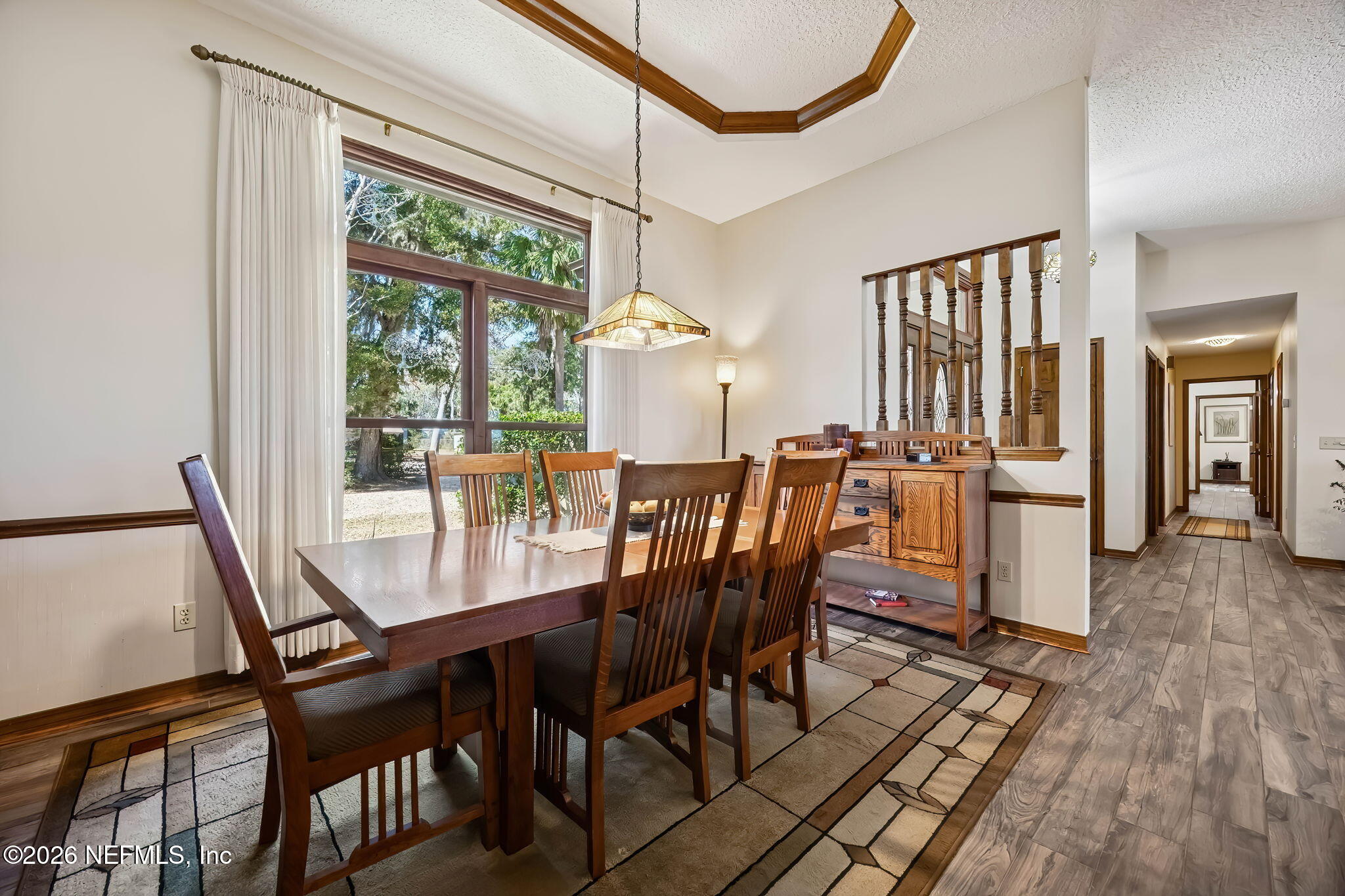 97146 Pirates Point Road Yulee, FL 32097 - Photo 15 of 74 a view of a dining room with furniture window and wooden floor