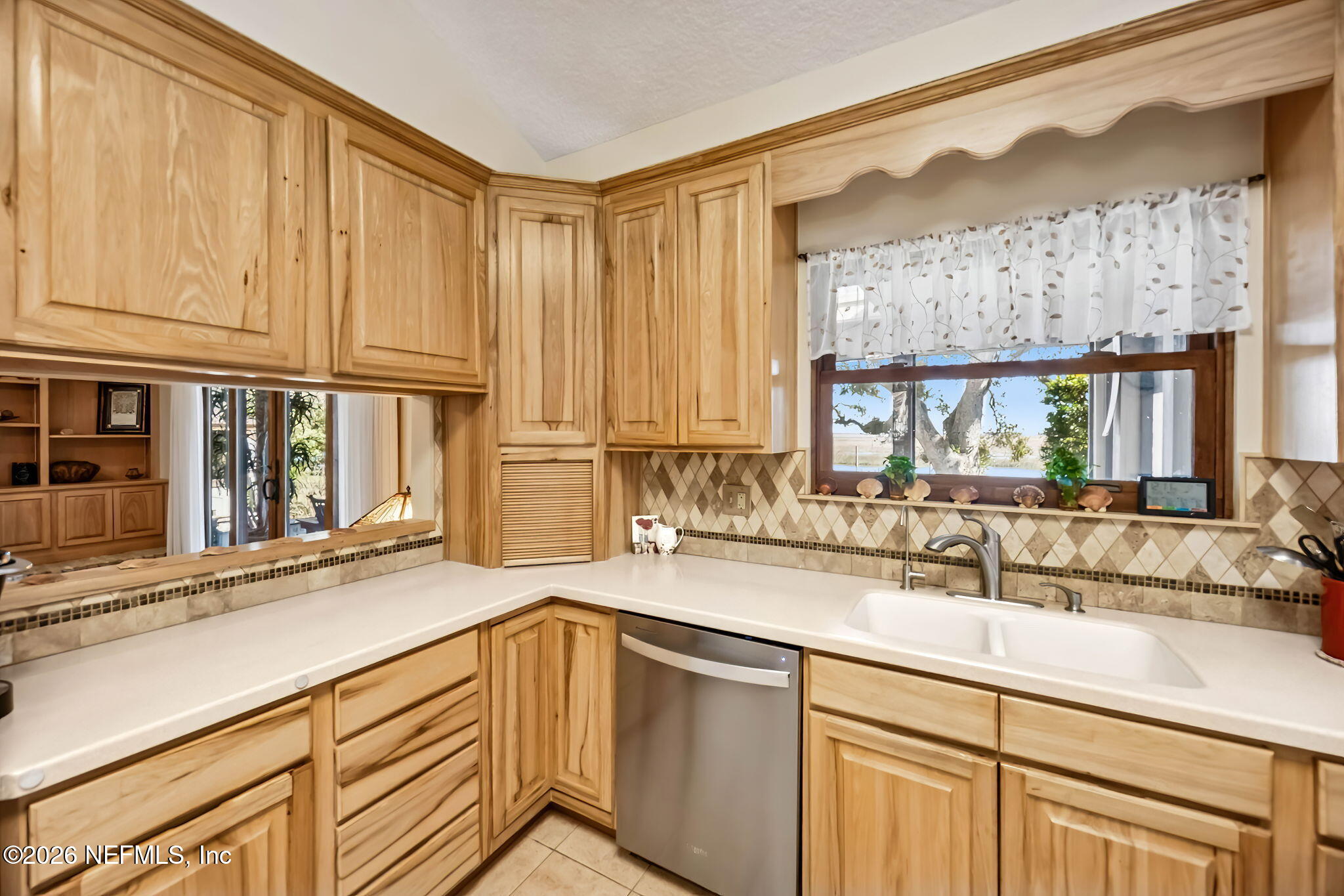 97146 Pirates Point Road Yulee, FL 32097 - Photo 18 of 74 a kitchen with granite countertop a sink and a window