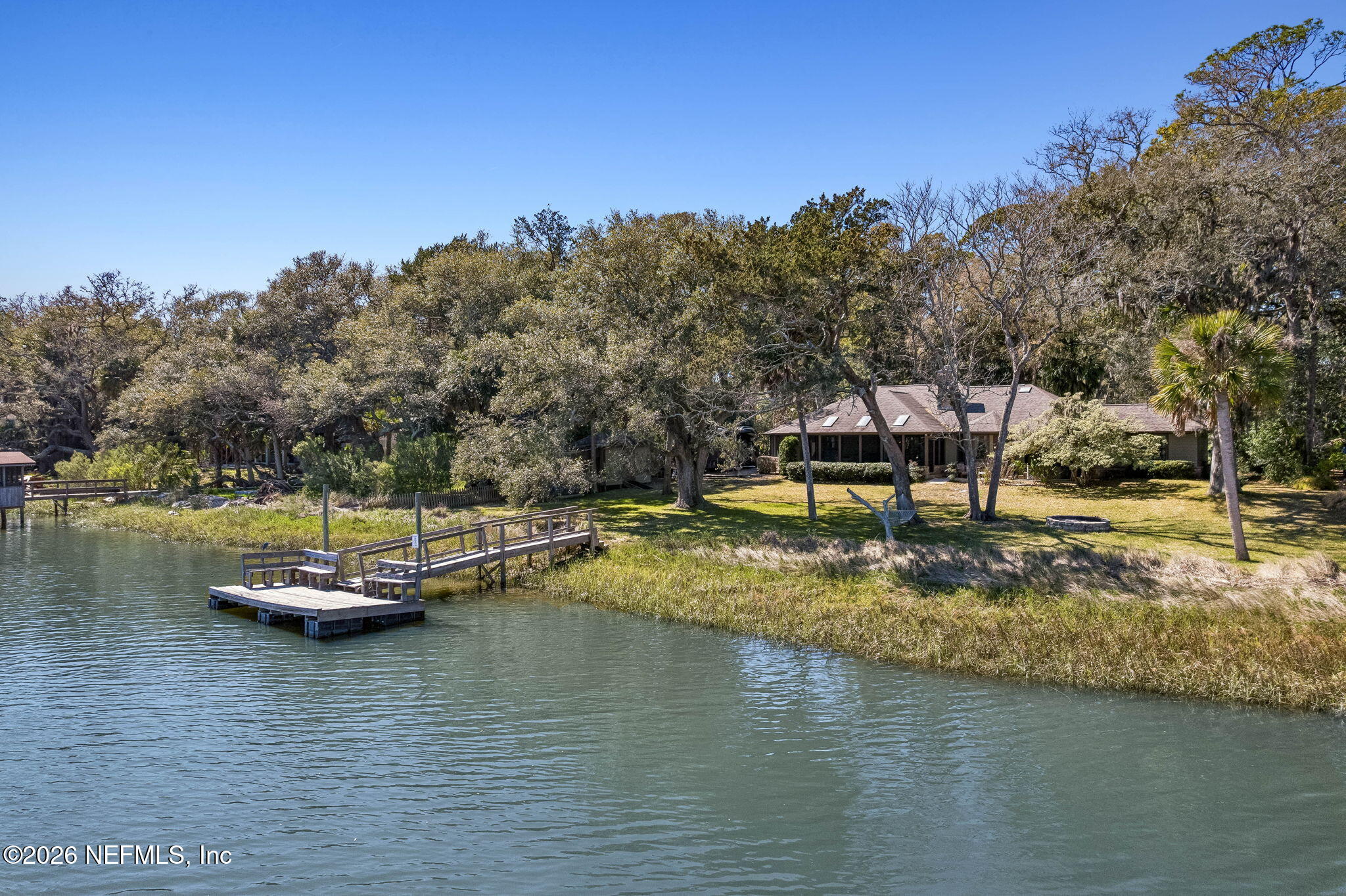 97146 Pirates Point Road Yulee, FL 32097 - Photo 3 of 74 a view of a lake with a mountain view