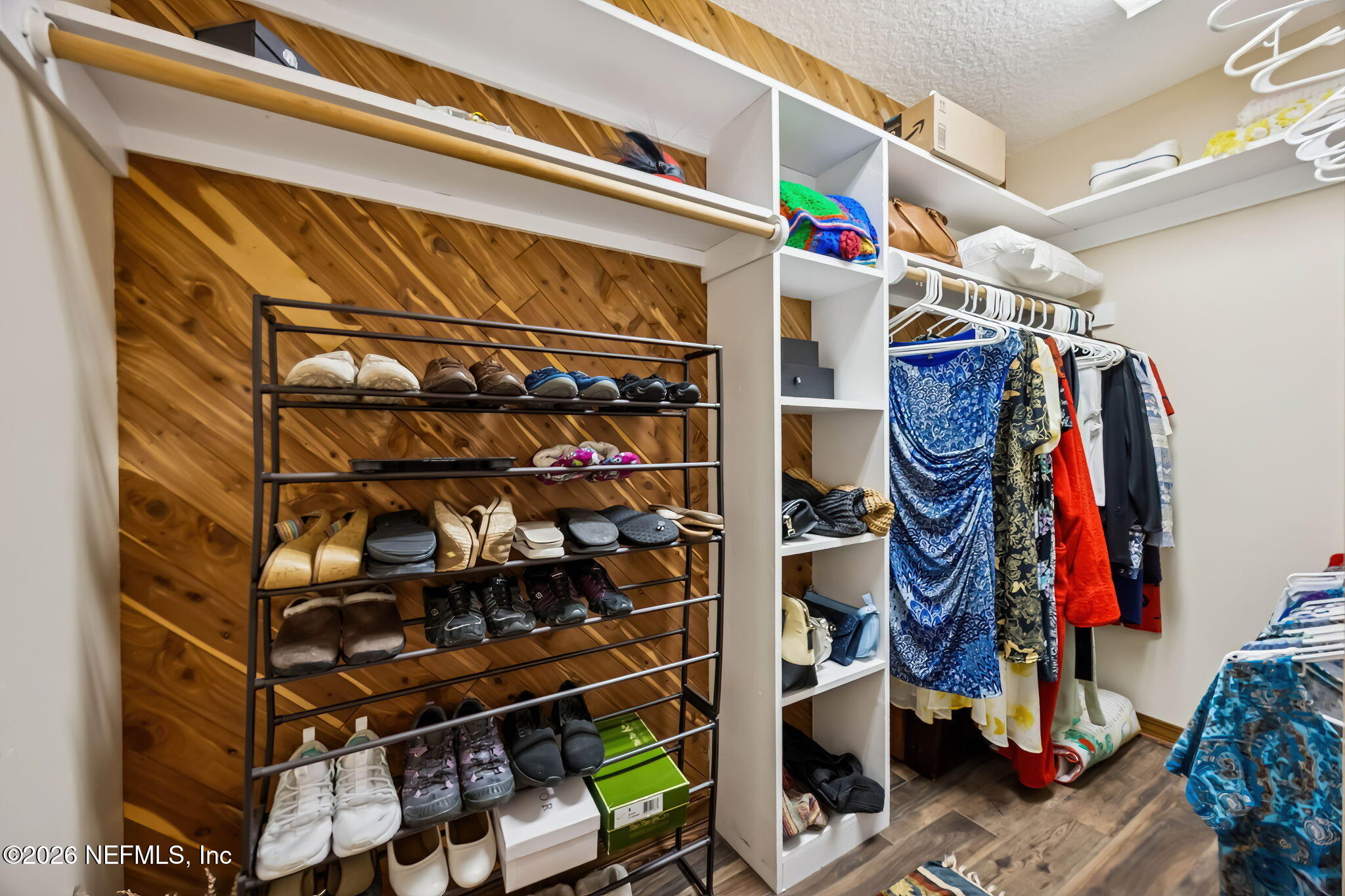 97146 Pirates Point Road Yulee, FL 32097 - Photo 30 of 74 a view of walk in closet with clothes and shoes