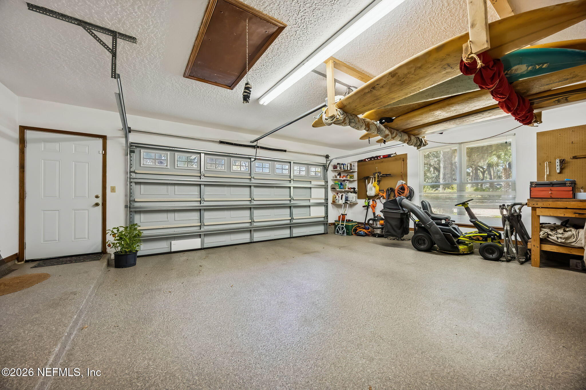 97146 Pirates Point Road Yulee, FL 32097 - Photo 39 of 74 a view of a garage with parked cars