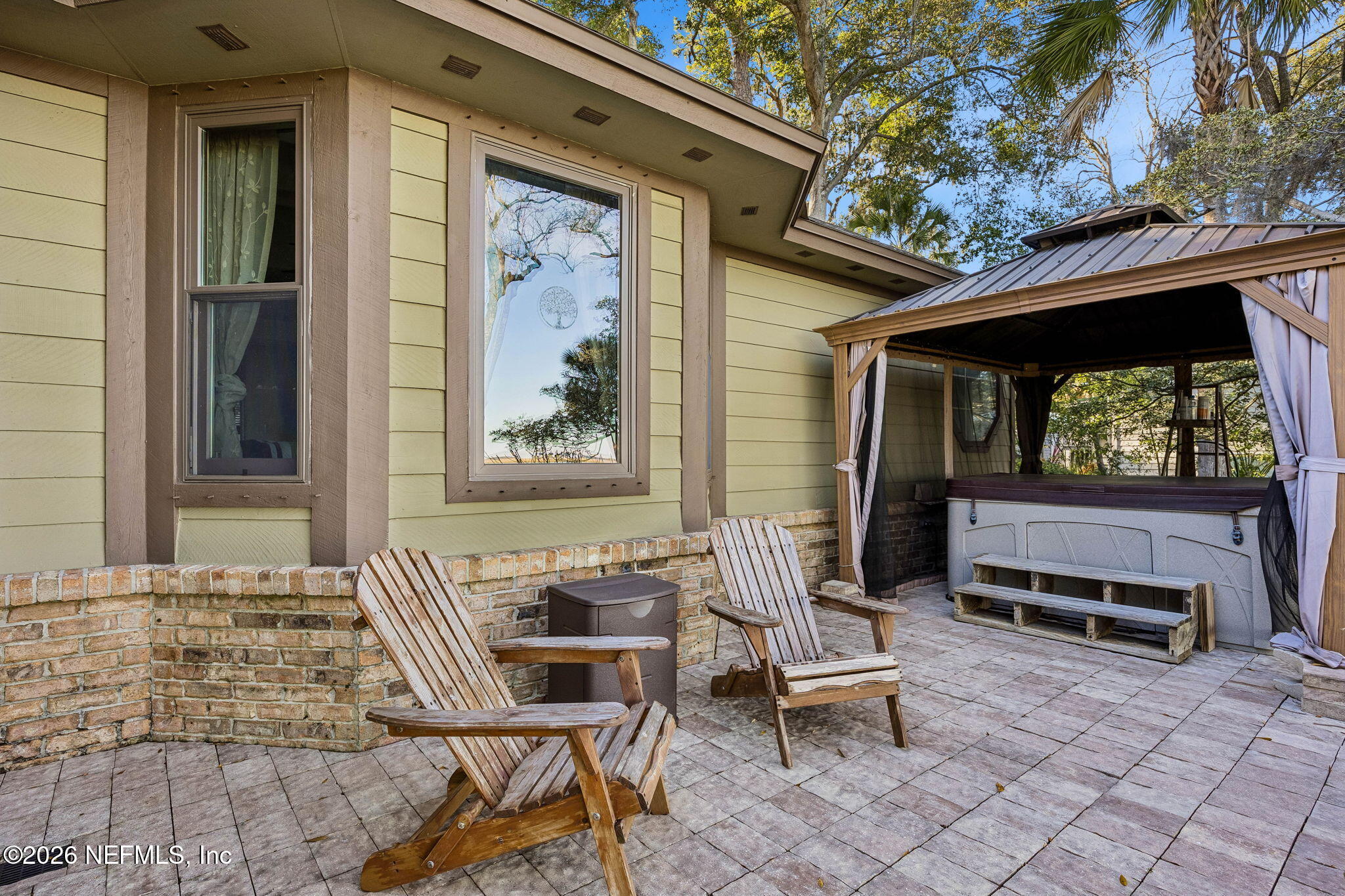 97146 Pirates Point Road Yulee, FL 32097 - Photo 44 of 74 a outdoor space with a couch and chairs