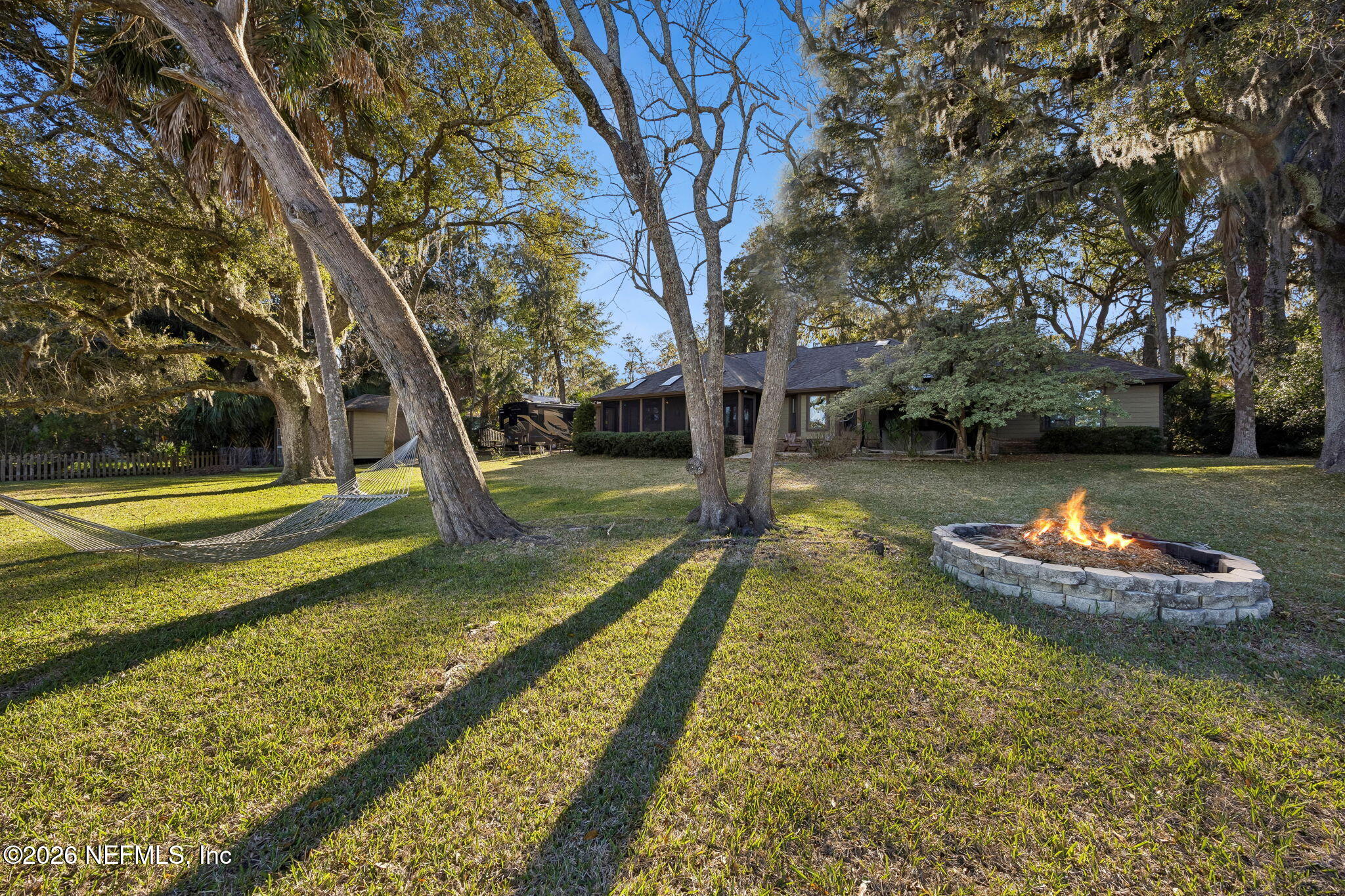 97146 Pirates Point Road Yulee, FL 32097 - Photo 56 of 74 a view of a swimming pool with a yard