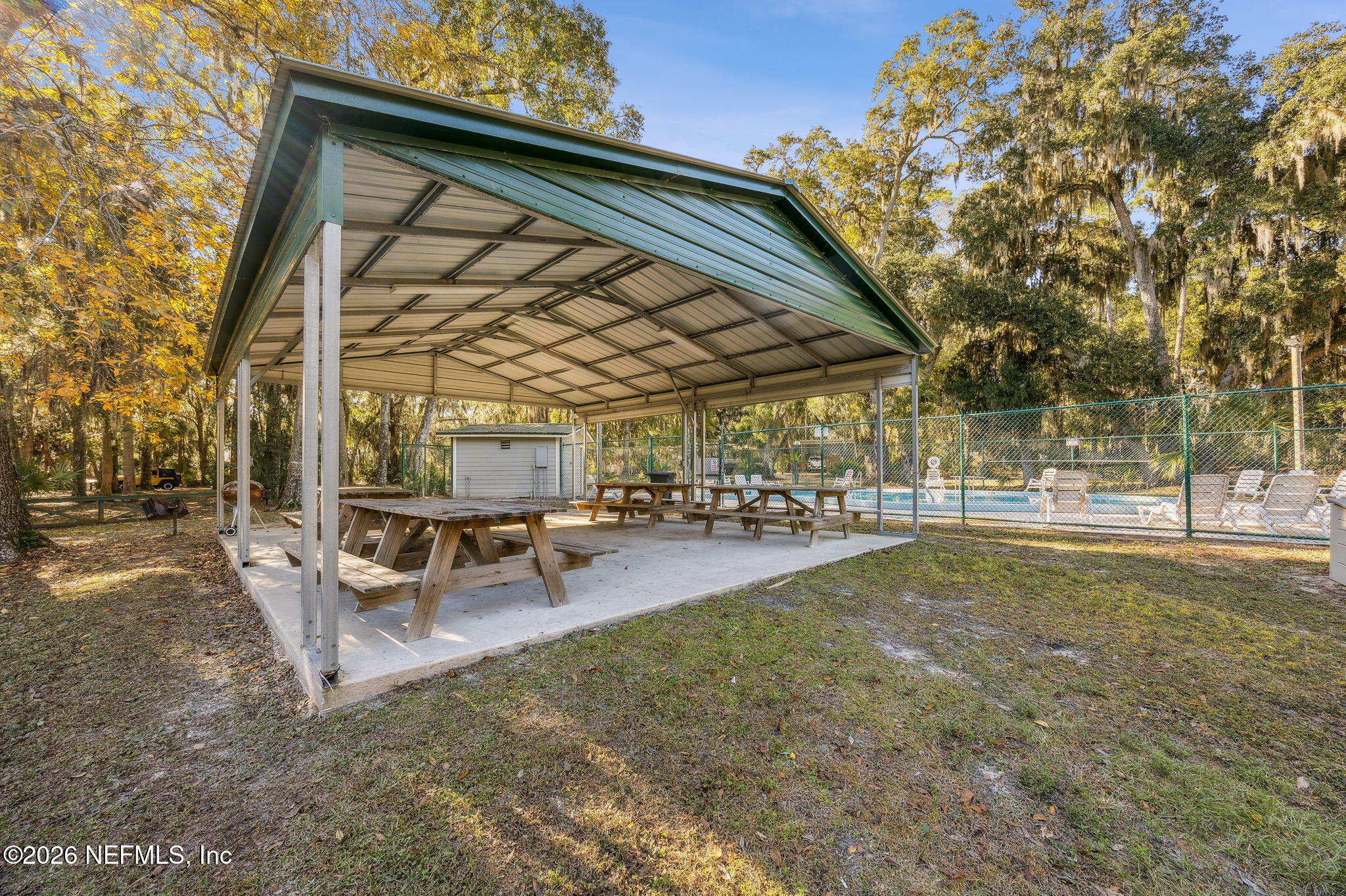 97146 Pirates Point Road Yulee, FL 32097 - Photo 69 of 74 a view of a house with backyard and sitting area