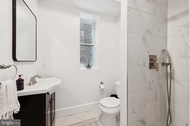 a living room with furniture and a piano