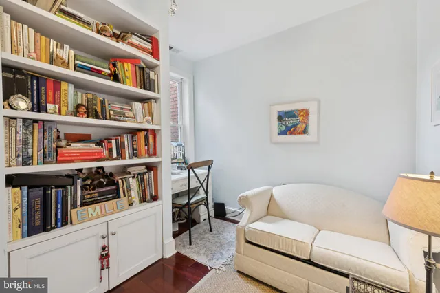 a bedroom with bed and window