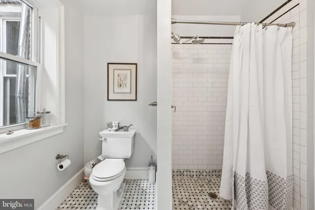 a bedroom with furniture and a book shelf