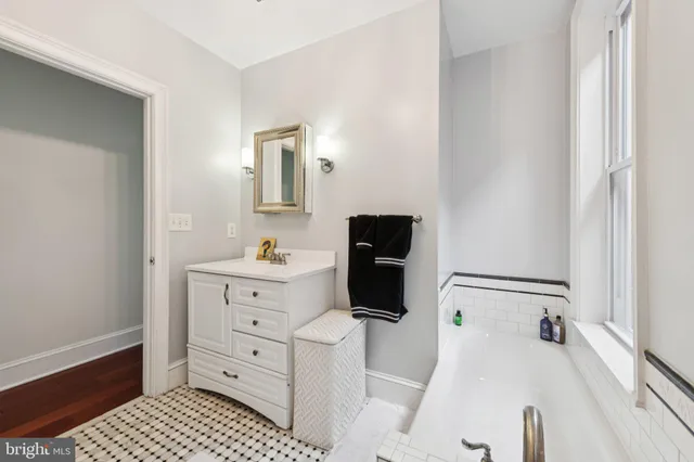 a living room with lots of books