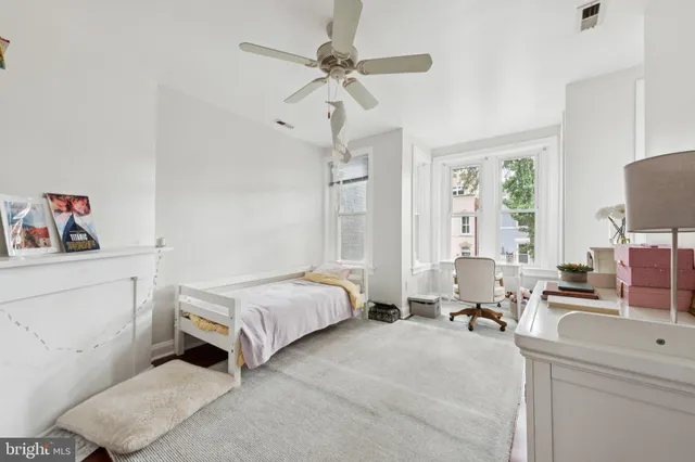 a spacious bathroom with a sink and a mirror