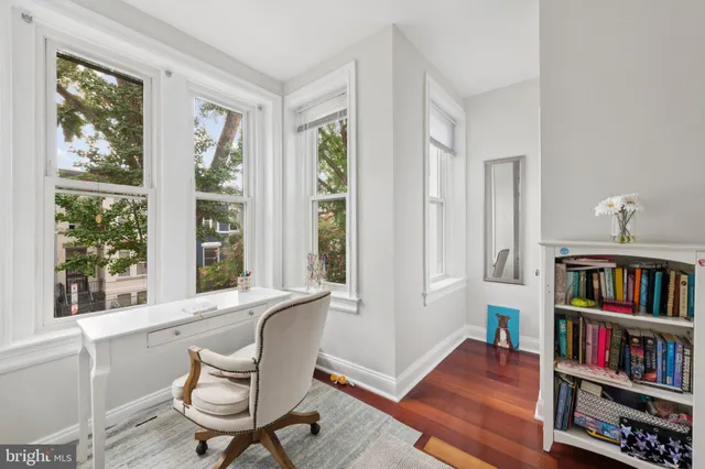 a bathroom with a bathtub sink and mirror