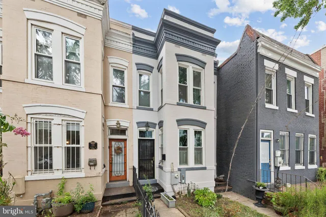 a bedroom with a bed furniture and a chandelier