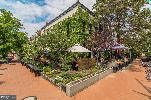 front view of a brick house with a large windows