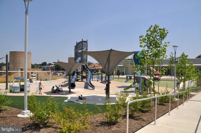 a view of a backyard with sitting area