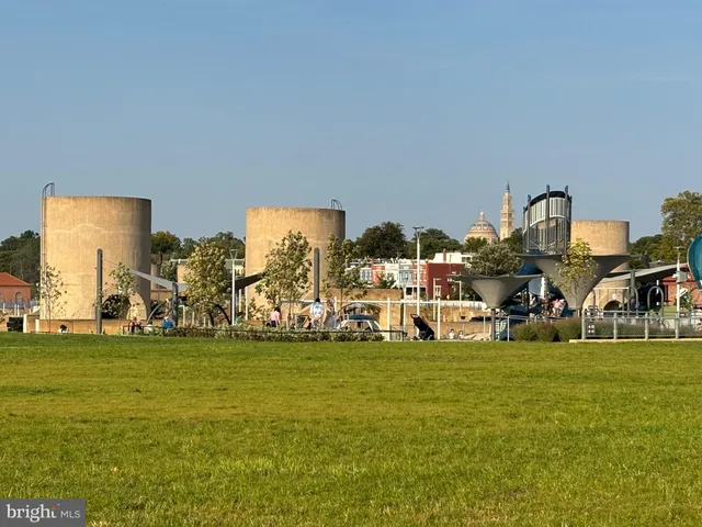 swimming pool view with a seating space