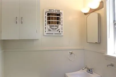 a bathroom with a shower and a window