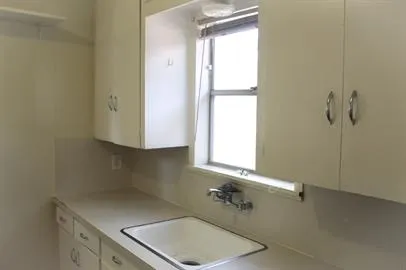 a bathroom with a sink and a window
