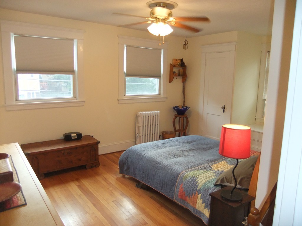 53 Newhall Street Springfield, MA 01109 - Photo 18 of 29 a bedroom with a bed and a chandelier