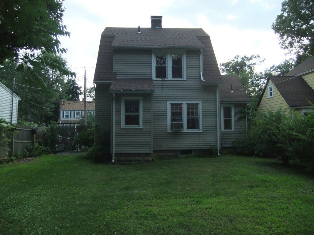 53 Newhall Street Springfield, MA 01109 - Photo 25 of 29 a front view of a house with a garden