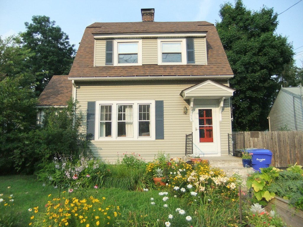 53 Newhall Street Springfield, MA 01109 - Photo 3 of 29 a front view of a house with a yard