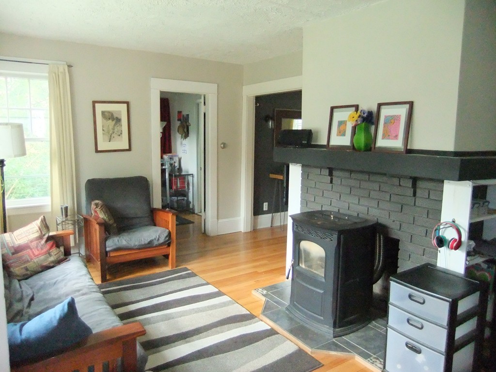 53 Newhall Street Springfield, MA 01109 - Photo 4 of 29 a living room with furniture and a fireplace