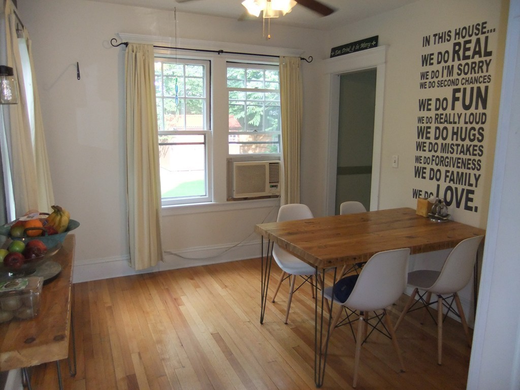 53 Newhall Street Springfield, MA 01109 - Photo 9 of 29 a view of a dining room with furniture and wooden floor