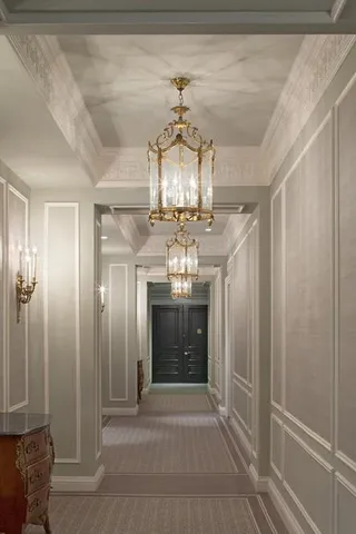 a room with lots of chairs and chandelier