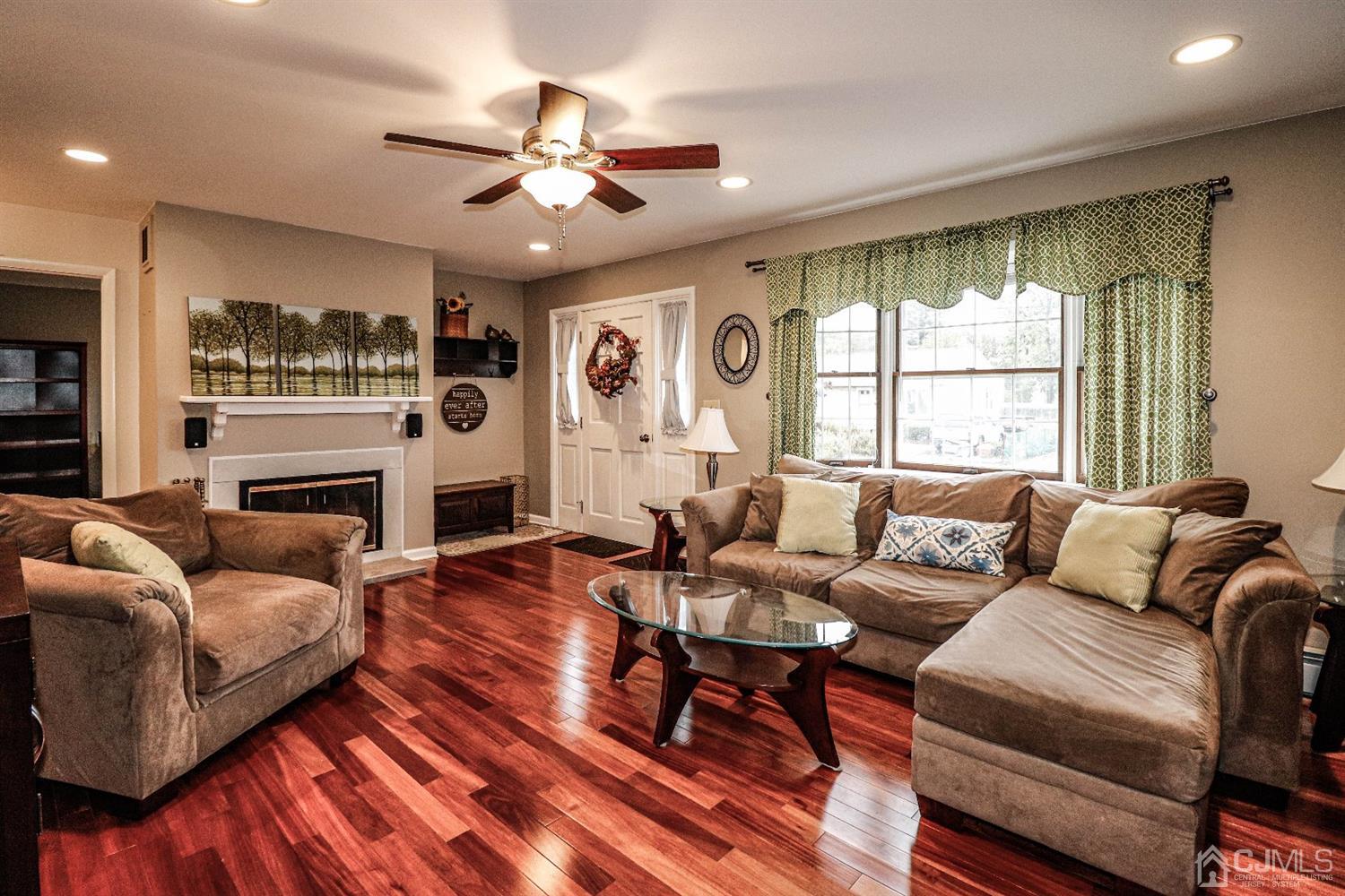 32 Rector Avenue Woodbridge, NJ 07095 - Photo 4 of 29 a living room with furniture a large window and a fireplace
