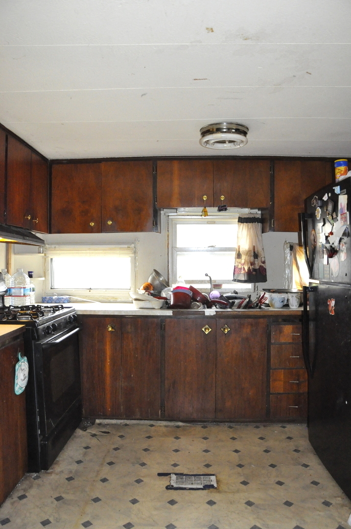 3350 East 2059th Road Ottawa, IL 61350 - Photo 20 of 23 a kitchen with stainless steel appliances granite countertop a sink stove and granite counter top