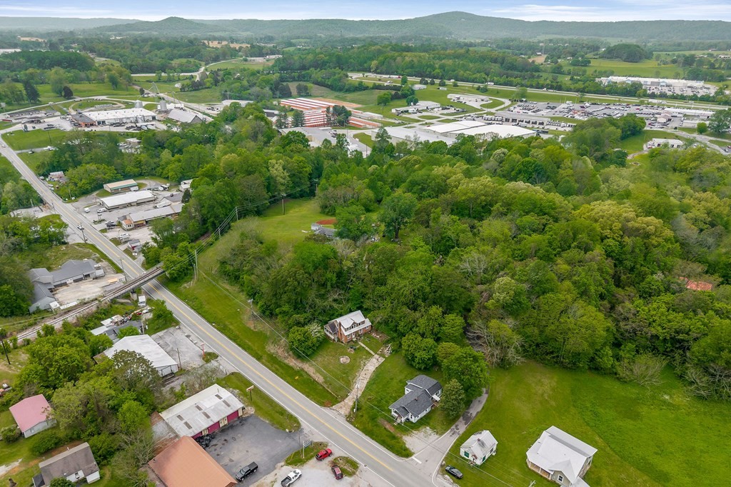 147 Mayberry Street Sparta, TN 38583 - Photo 18 of 22 an aerial view of residential houses with outdoor space and river view