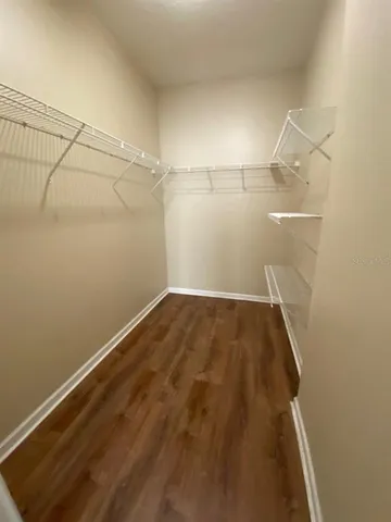 an empty room with racks on the wall