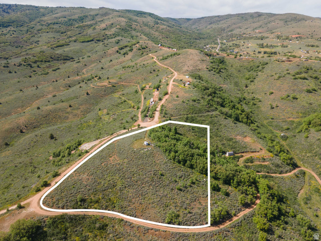 73 North River View Road, Unit 73 Huntsville, UT 84317 - Photo 3 of 21 Expansive undeveloped land parcel featuring varied terrain, natural vegetation, and a partially wooded area