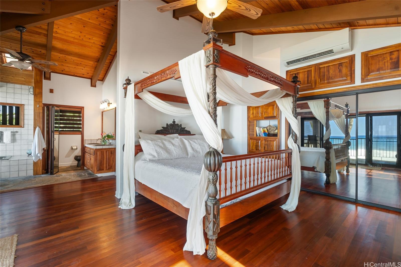 59-377 Ke Nui Road Haleiwa, HI 96712 - Photo 15 of 25 a bedroom with furniture and wooden floor