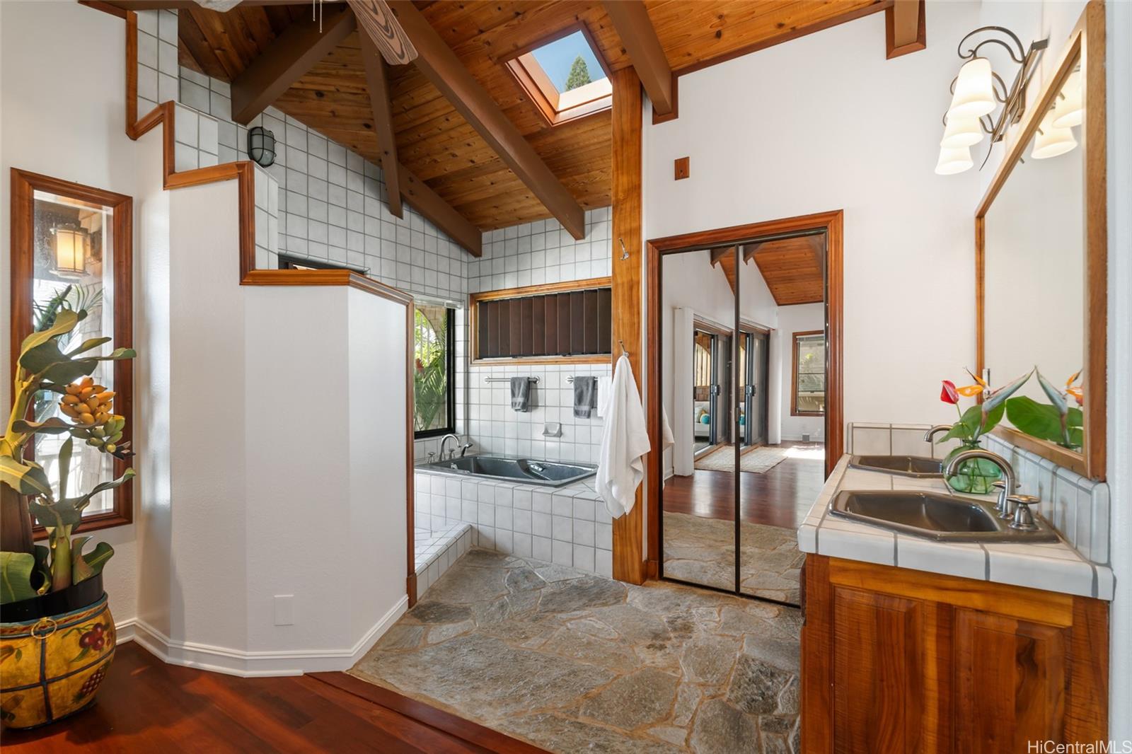 59-377 Ke Nui Road Haleiwa, HI 96712 - Photo 16 of 25 a view of living room kitchen with furniture and wooden floor