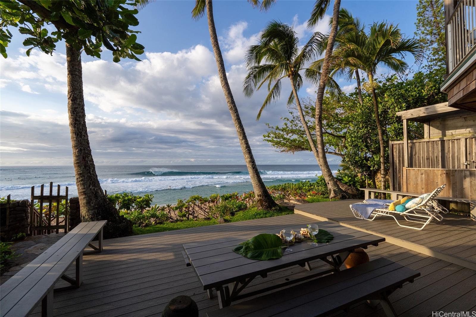 59-377 Ke Nui Road Haleiwa, HI 96712 - Photo 8 of 25 a view of a balcony with wooden floor and outdoor seating